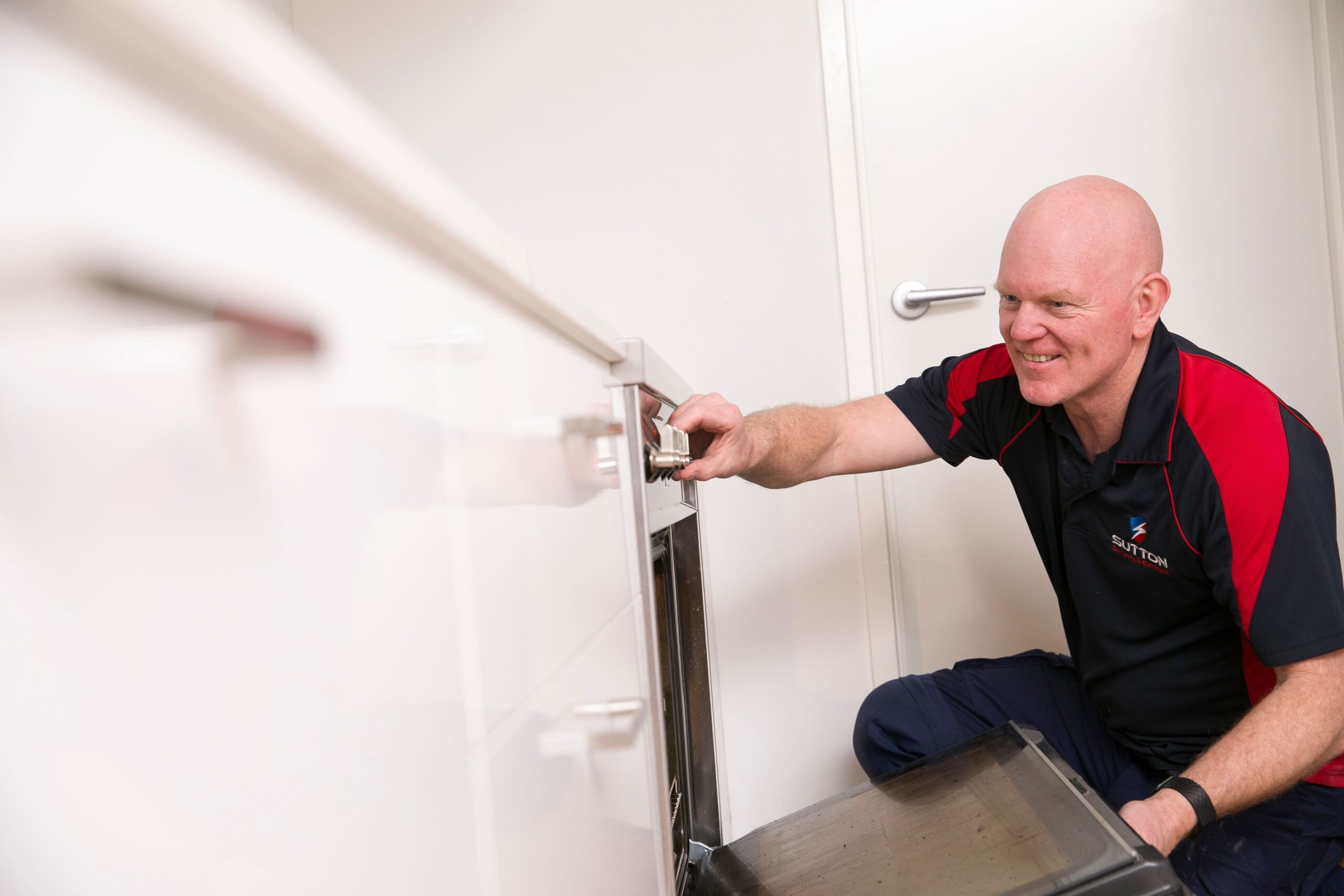 Electrician Repairing Oven