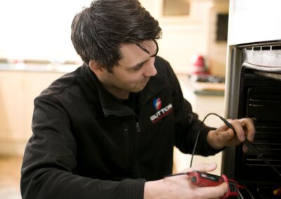 Oven technician testing oven