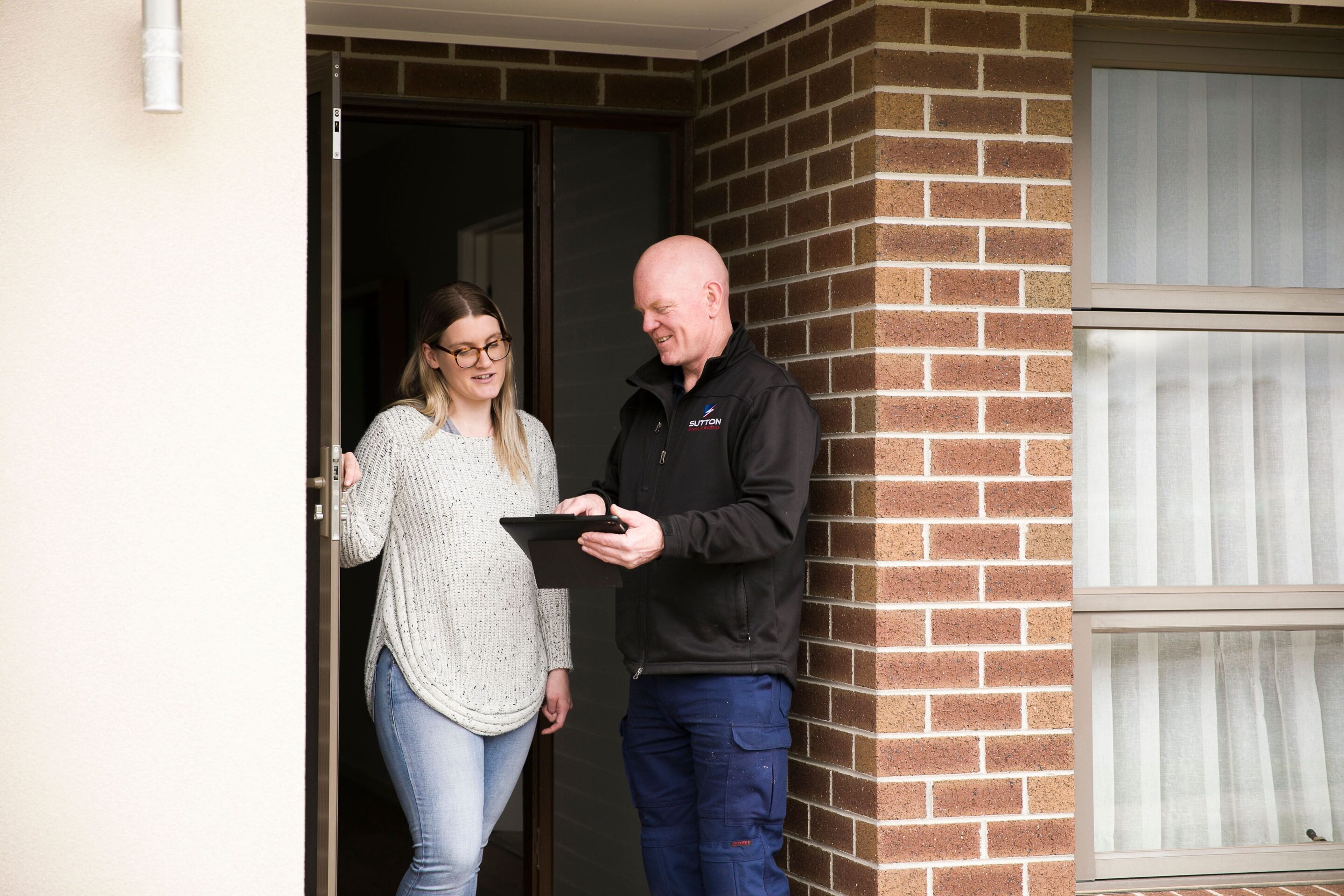 Ken with a Sutton Security & Electrics customer.